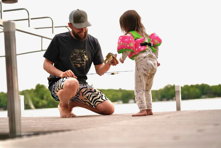 Mitch Pantzke with his daughter teaching the values of fishing