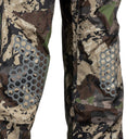 Pnuma Outdoors Element Rain Pants designed with built-in padded knees for added comfort and protection during long sits, stalks, or kneeling in wet, rugged terrain. These waterproof, breathable rain pants feature quiet 3-layer construction, full-length side zips for easy layering, and a packable design—making them ideal rain gear for hunting in challenging weather and rough ground conditions.
