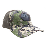 Angled view of Pnuma trucker hat with rubberized logo on caza camo pattern